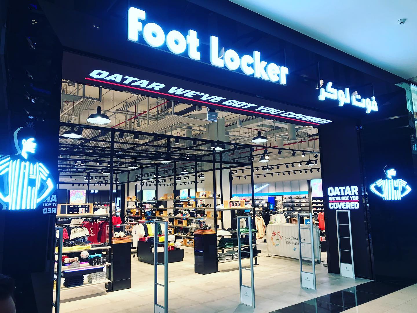 Premium interior with illuminated fixtures at Foot Locker Doha Pearl